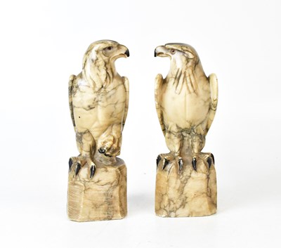 Lot 518 - A pair of Art Deco alabaster models of falcons,...