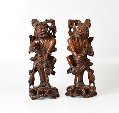 Lot 389 - A pair of Japanese carved wooden figures of...