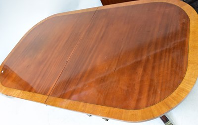 Lot 30 - A Regency-style mahogany crossbanded twin...