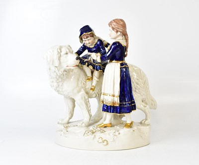 Lot 226 - ROYAL DUX; a porcelain figure group of a child...
