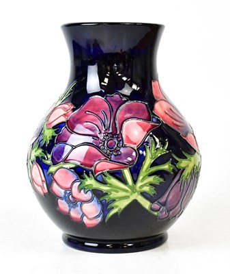 Lot 306 - MOORCROFT; an 'Anemone' pattern vase of...