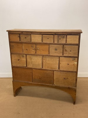 Lot 431 - A pine bank of graduated drawers with an...