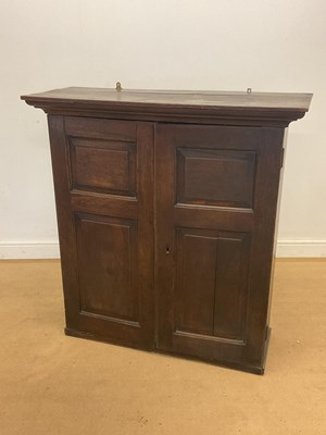Lot 408 - An oak cupboard with adjustable split shelves...