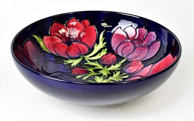 Lot 304 - MOORCROFT; an 'Anemone' pattern fruit bowl on...