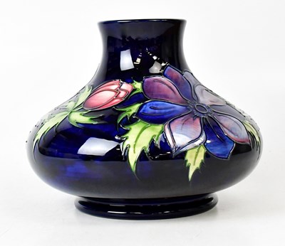 Lot 308 - MOORCROFT; an 'Anemone' pattern vase of squat...