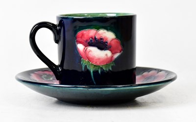 Lot 303 - MOORCROFT; an 'Anemone' pattern cabinet cup...