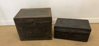 Lot 18 - A leather stud decorated trunk and a canvas...