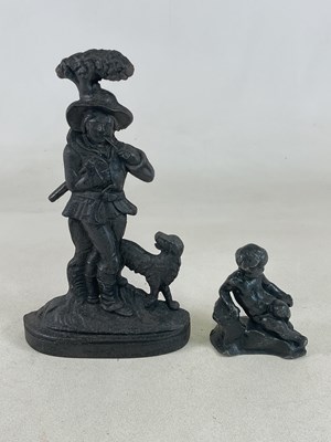 Lot 115 - A cast iron doorstop, 'The Woodsman and his...