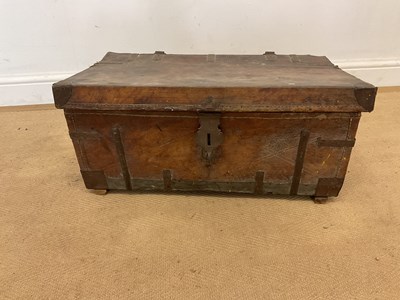 Lot 26 - A 19th century strap bound leather trunk, with...