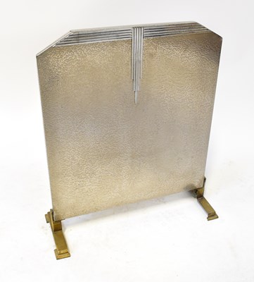 Lot 48 - An Art Deco chromed textured firescreen on...