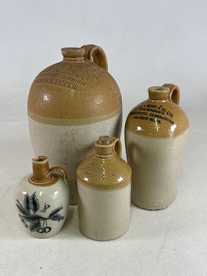 Lot 201 - Four stoneware advertising flagons, each with...