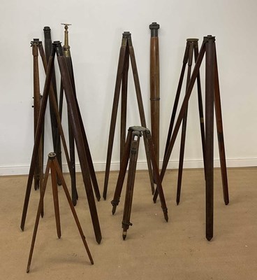 Lot 70 - A quantity of surveyors' tripods, together...