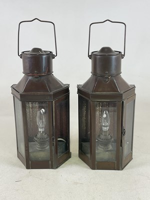 Lot 341 - A pair of brass hanging lanterns with glass...