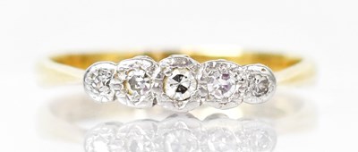 Lot 796 - An 18ct yellow gold ring set with five...