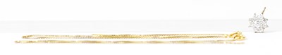 Lot 853 - A 9ct yellow gold pendant set with white...