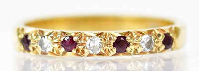 Lot 801 - An 18ct yellow gold half-eternity ring set...
