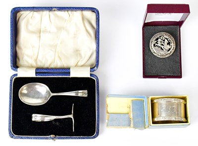 Lot 689 - A white metal brooch pierced with an image of...
