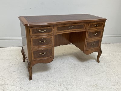 Lot 47 - A reproduction walnut serpentine fronted...