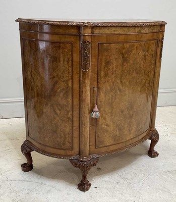 Lot 56 - A reproduction walnut demi-lune side cabinet...