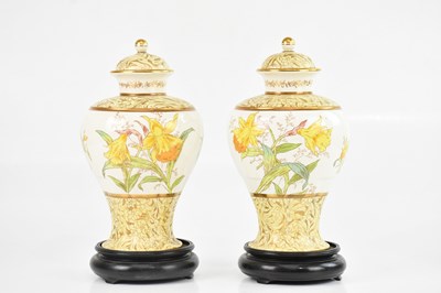 Lot 1740 - WEDGWOOD; a pair of 19th century lidded vases,...