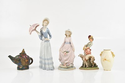 Lot 1653 - LLADRÓ; two figures including a girl clutching...