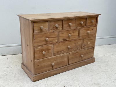 Lot 69 - A modern pine chest of twelve drawers, height...
