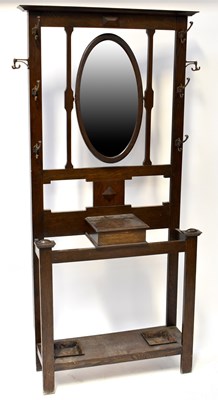 Lot 38 - An early 20th century oak hall stand, the...