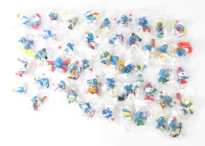 Lot 437 - THE SMURFS; a quantity of plastic figures,...