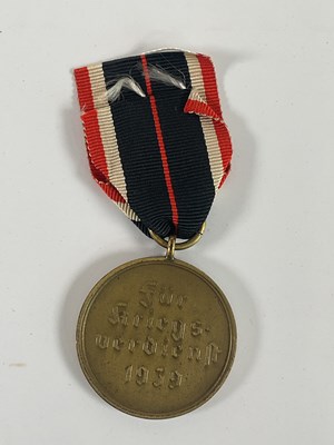 Lot 244 - A WWII 1939 German Merit Medal, inscribed 'Fur...