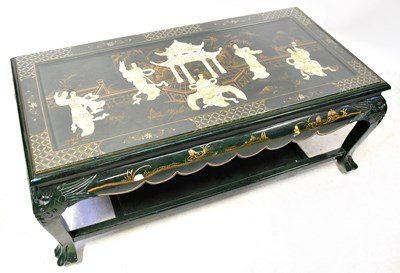 Lot 396 - An Oriental lacquered coffee table with inlaid...