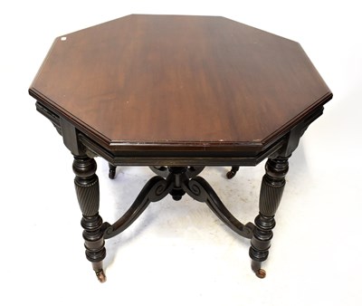 Lot 60 - An Edwardian mahogany octagonal top table on...