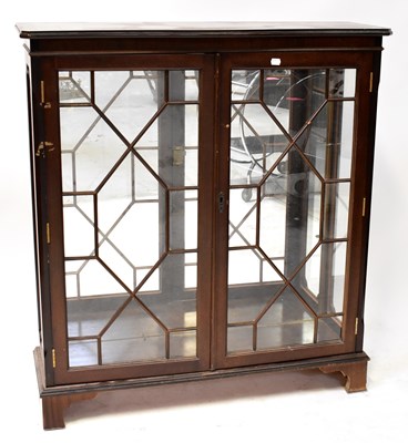 Lot 24 - A reproduction mahogany display cabinet with a...