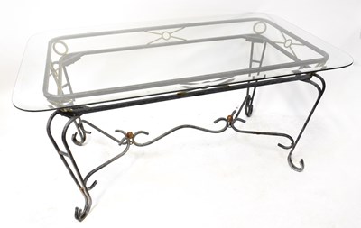 Lot 112 - A modern garden table with bevelled glass top,...