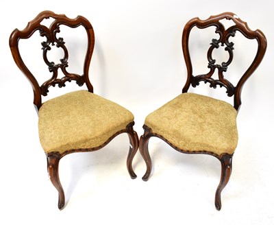 Lot 68 - A pair of Victorian walnut shield-back dining...