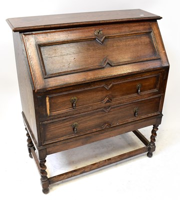 Lot 42 - A 1930s oak bureau of Jacobean style, with...