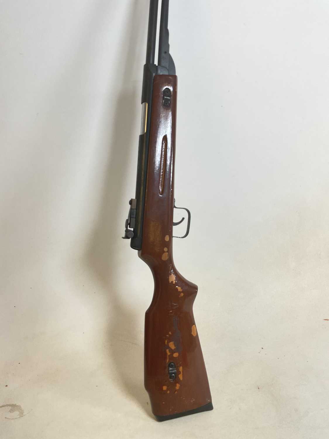 Lot 133 - A vintage air rifle with painted stock.