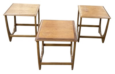 Lot 42 - G PLAN; a set of three teak mid century coffee...