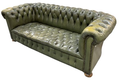 Lot 15 - A modern green button upholstered leather...