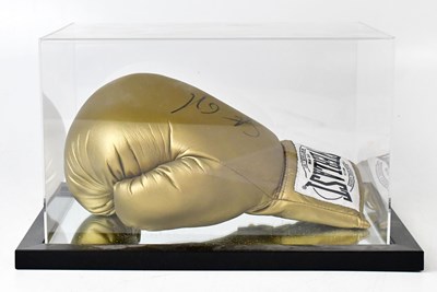 Lot 560 - STEPHEN COLLINS; a Everlast champagne-coloured...
