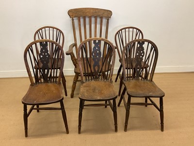 Lot 407 - Three elm wheel back chairs, height 87cm,...