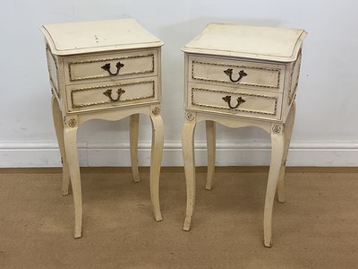 Lot 420 - A pair of cream and gilt decorative bedside...