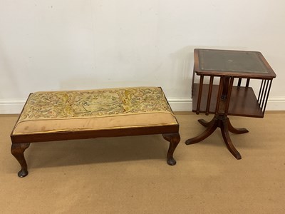 Lot 421 - A reproduction revolving bookcase with leather...