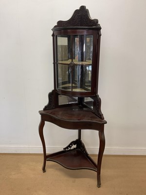 Lot 450 - An Edwardian mahogany corner cupboard, with...