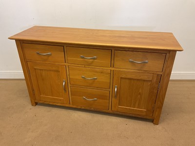 Lot 442 - A modern contemporary light oak dresser base...