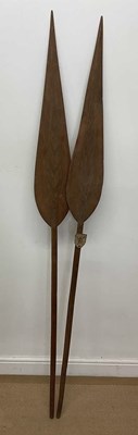 Lot 111 - A pair of carved paddles with incised...