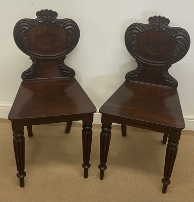 Lot 389 - A pair of William IV mahogany hall chairs,...