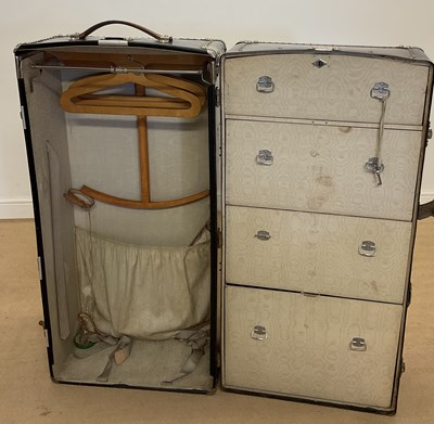 Lot 425 - An early 20th century steamer trunk, enclosing...