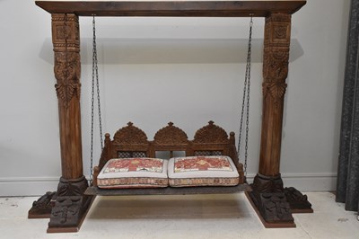 Lot 1079 - An Indian carved hardwood swing bench, height...