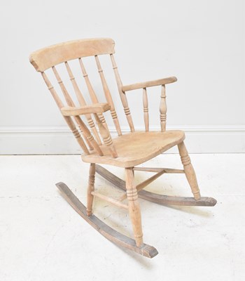 Lot 1039 - A rustic pine rocking chair.