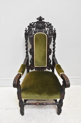 Lot 1164 - An early 20th century carved oak elbow chair,...